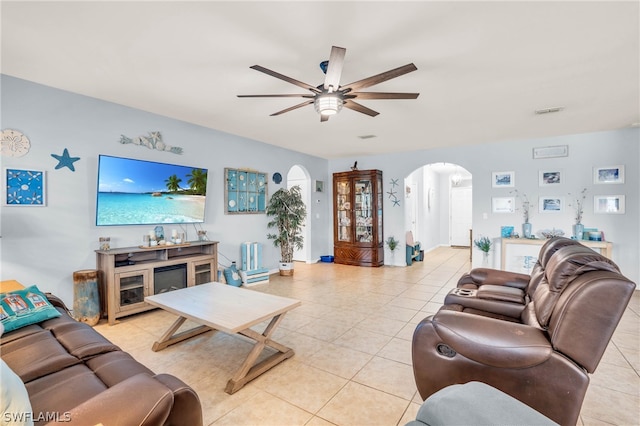 living room with ceiling fan and light tile patterned floors