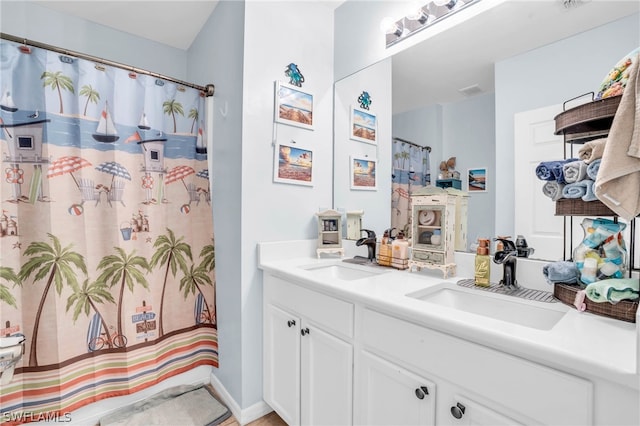 bathroom featuring double vanity