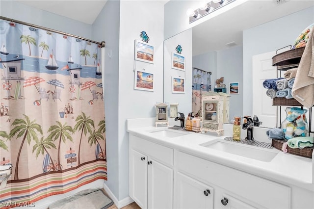 bathroom featuring vanity and walk in shower