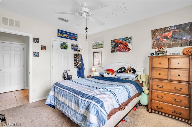 tiled bedroom with ceiling fan