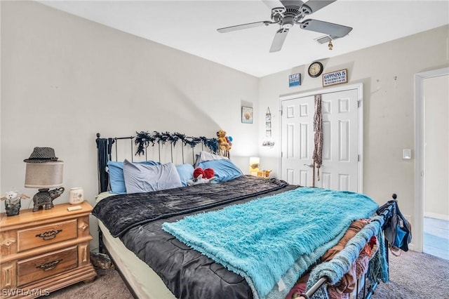 bedroom with carpet floors, ceiling fan, and a closet