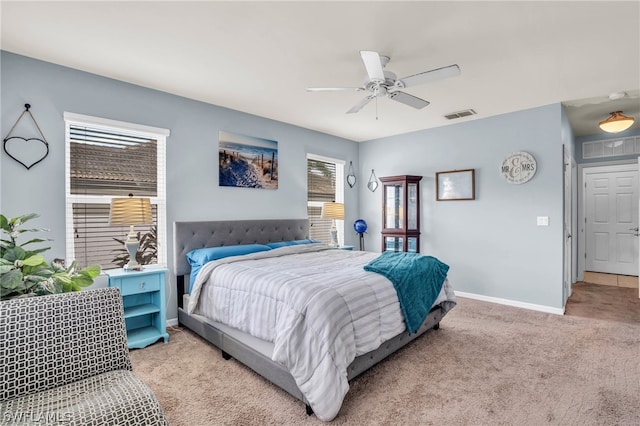 bedroom with light carpet and ceiling fan