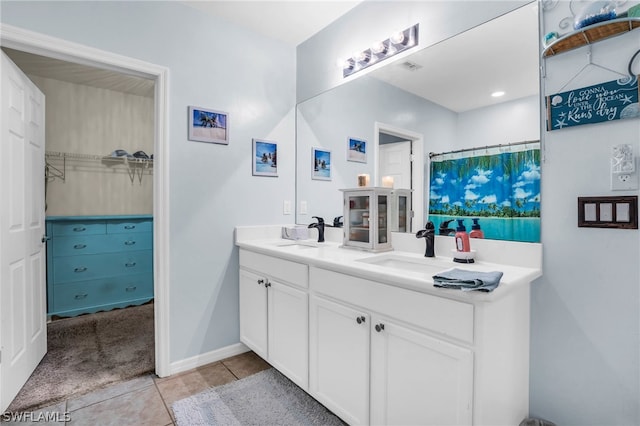 bathroom with tile patterned flooring and double sink vanity