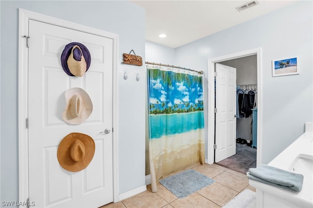 bathroom with tile patterned flooring