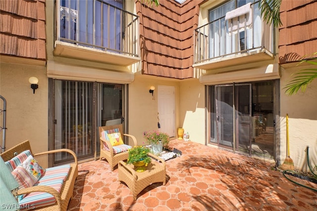 view of patio featuring a balcony