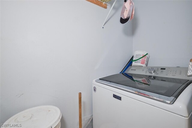 washroom with washer / clothes dryer