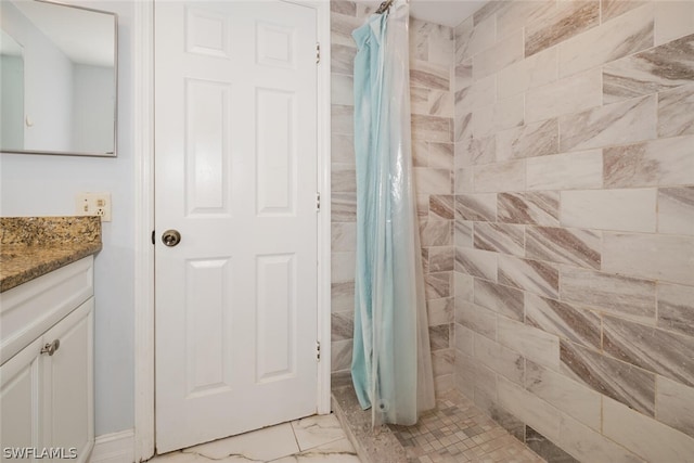 bathroom with vanity, a shower with curtain, and tile patterned floors