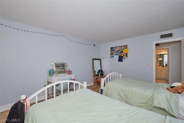 bedroom featuring hardwood / wood-style flooring