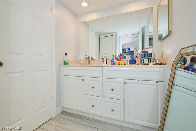 bathroom featuring vanity and tile patterned flooring