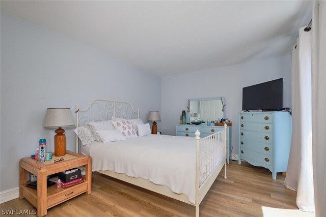 bedroom with light wood-type flooring