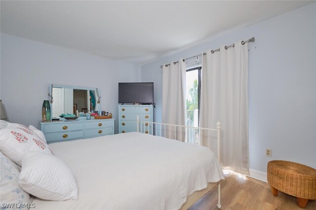 bedroom with light hardwood / wood-style floors