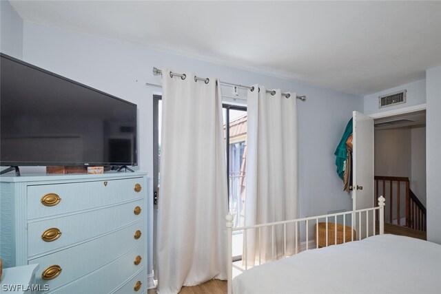 bedroom with wood-type flooring