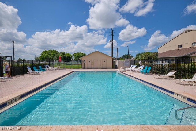 view of swimming pool with a patio