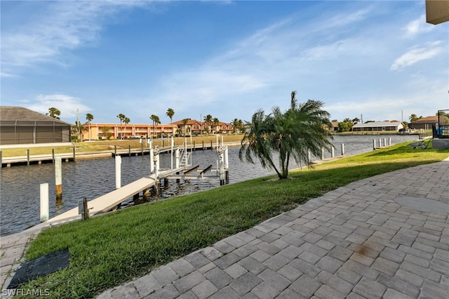 view of dock featuring a water view and a lawn