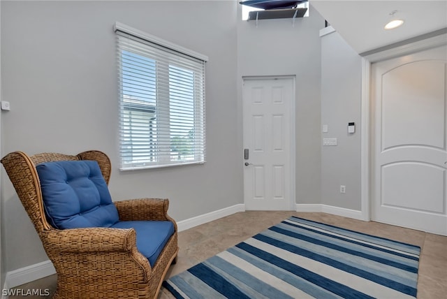 sitting room with light tile patterned flooring