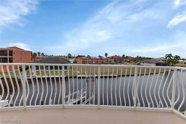 balcony featuring a water view