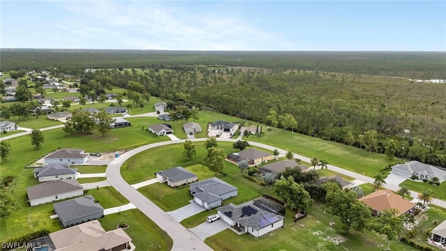 aerial view with a forest view and a residential view