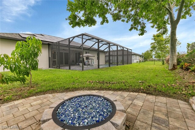 view of patio / terrace featuring glass enclosure