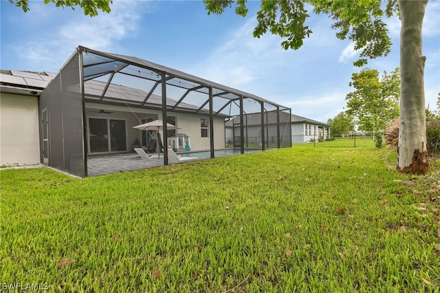 view of yard featuring a patio and a lanai