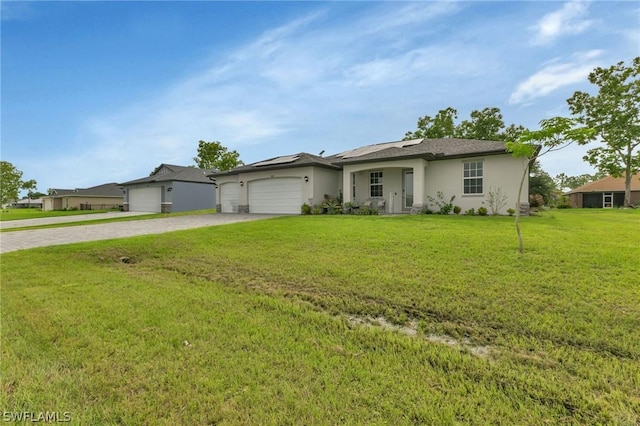 view of front of home featuring driveway, stucco siding, an attached garage, and a front yard