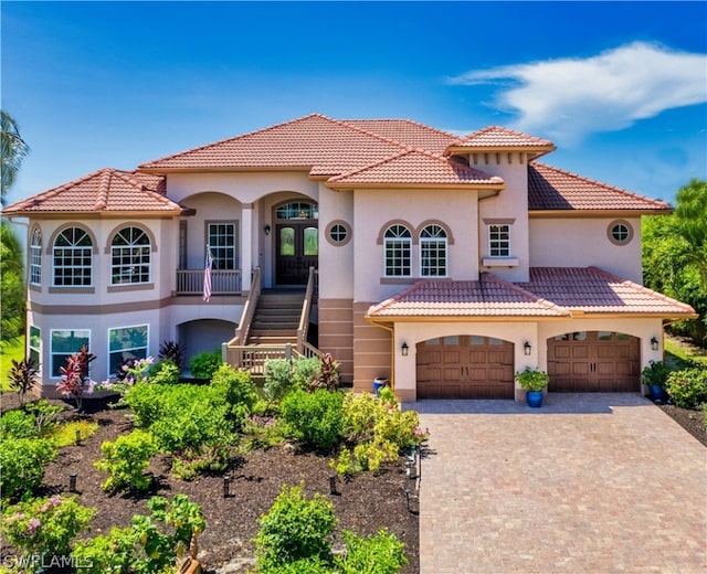 mediterranean / spanish-style home featuring a garage