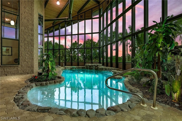 view of pool at dusk