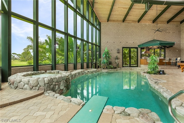 view of swimming pool with ceiling fan