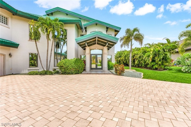 entrance to property featuring french doors