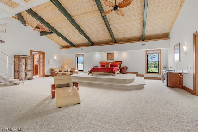 living room featuring beam ceiling, light colored carpet, wood ceiling, and high vaulted ceiling