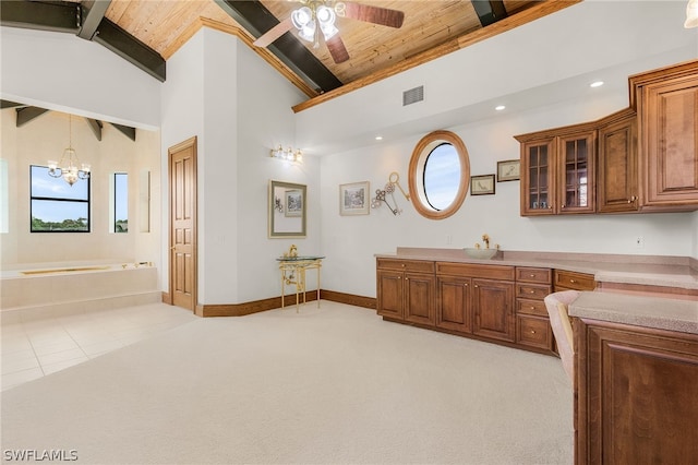 bathroom featuring ceiling fan with notable chandelier, high vaulted ceiling, wooden ceiling, and a tub