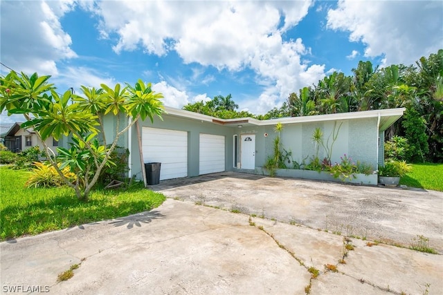 single story home featuring a garage