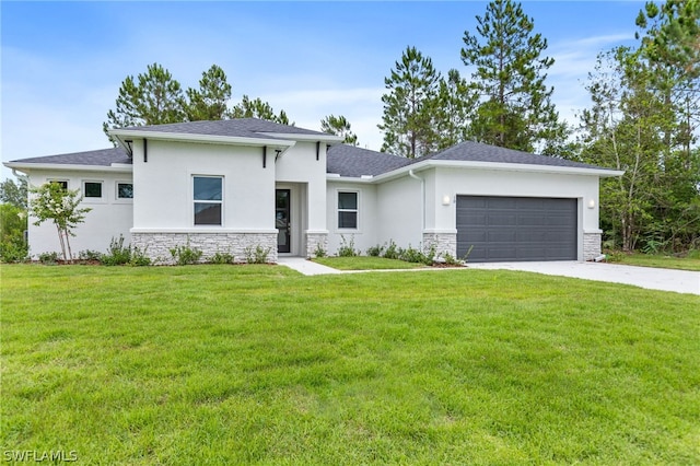 prairie-style house with a garage and a front lawn