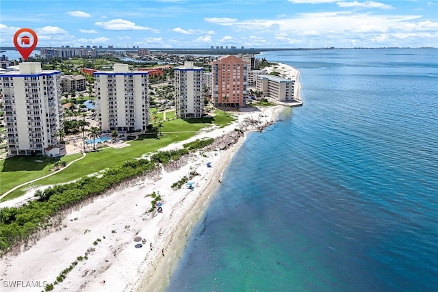 bird's eye view featuring a water view and a view of the beach