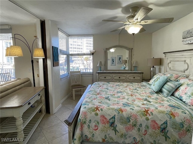 bedroom featuring ceiling fan and light tile patterned flooring