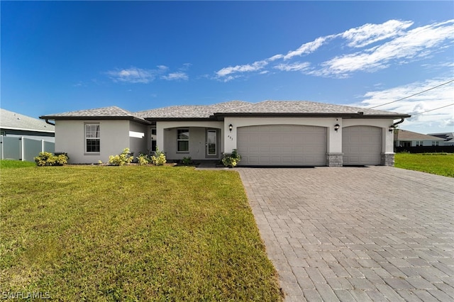 view of front facade featuring a garage and a front yard