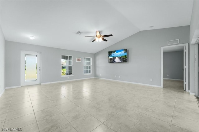 tiled spare room featuring vaulted ceiling and ceiling fan