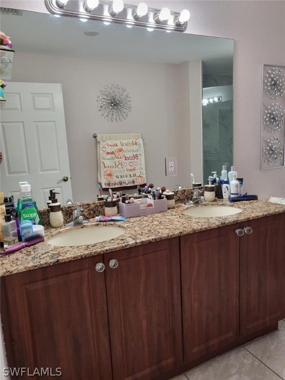 bathroom featuring tile patterned floors and dual bowl vanity