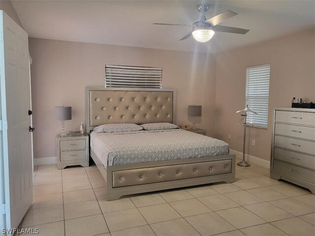 tiled bedroom with ceiling fan