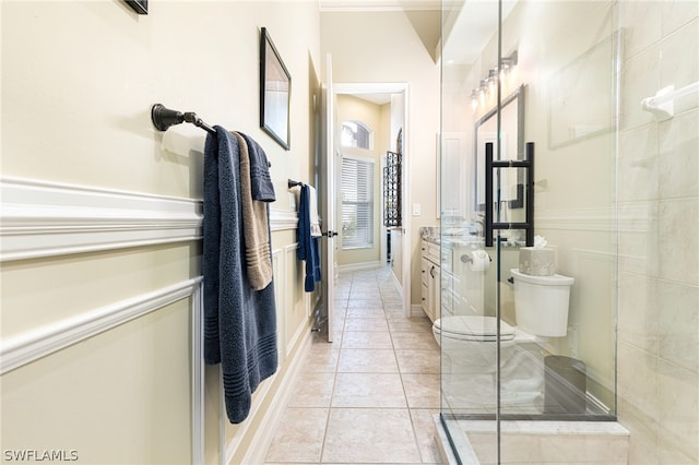 bathroom with tile patterned flooring, vanity, a shower with door, and toilet