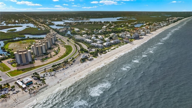 aerial view featuring a water view and a beach view