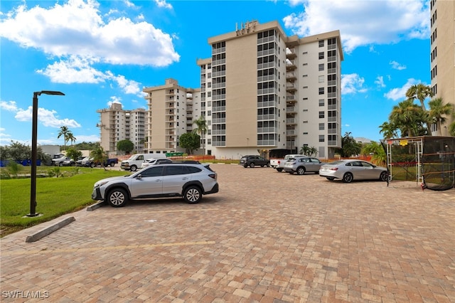 view of property featuring uncovered parking