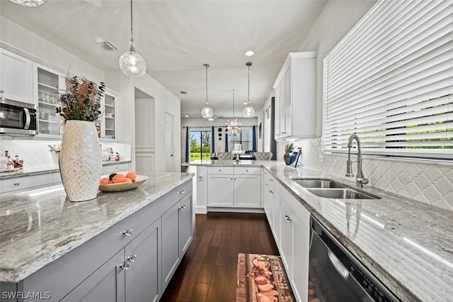 kitchen with tasteful backsplash, dark hardwood / wood-style flooring, sink, and stainless steel appliances