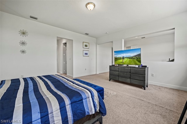 bedroom with light carpet