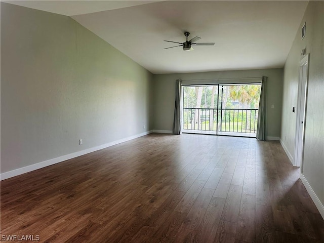 unfurnished room featuring vaulted ceiling, dark hardwood / wood-style floors, and ceiling fan