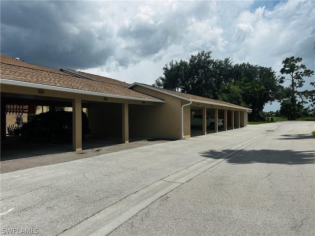 exterior space featuring a carport