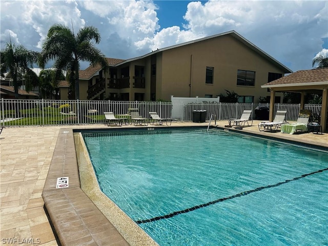 view of swimming pool featuring a patio