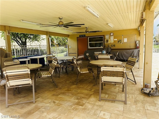 view of patio featuring ceiling fan