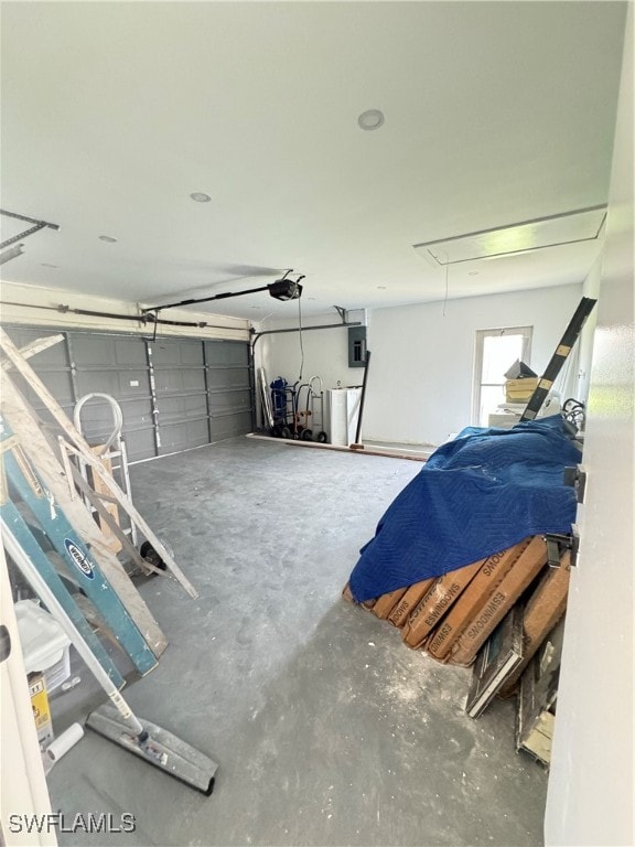 garage featuring a garage door opener and electric panel