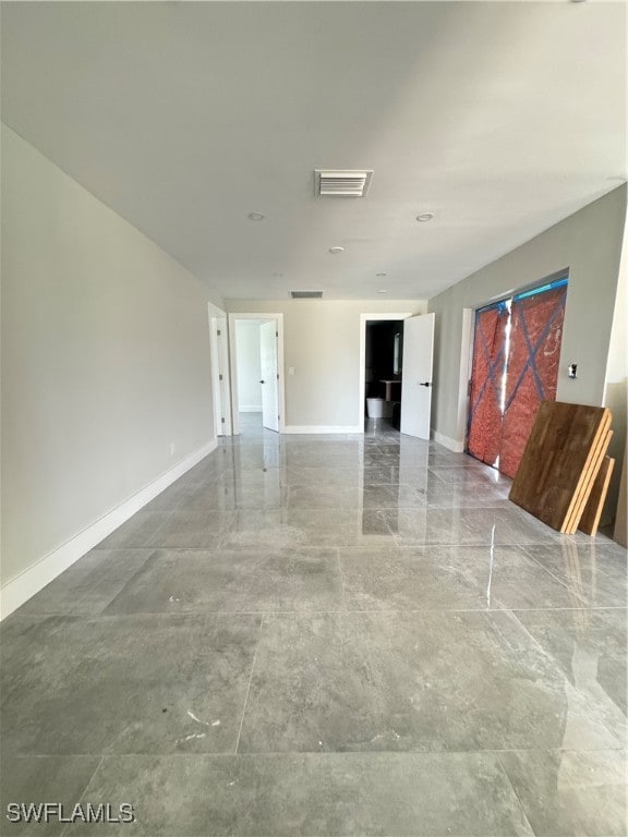 empty room with tile patterned floors