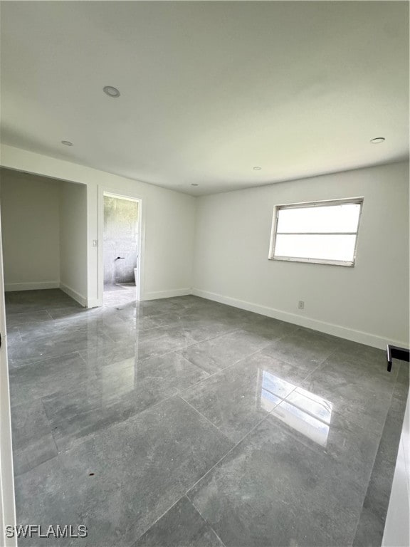 unfurnished room with tile patterned flooring